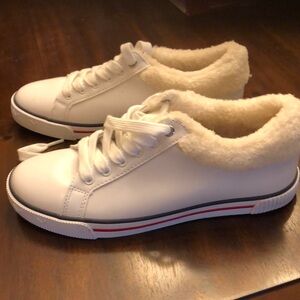 Tommy Hilfiger white sneaker.  Brand new. Never worn size 7.